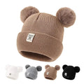Warm Knitted Baby Beanie with pom poms in a range of colours for autumn and winter warmth on daily outings.