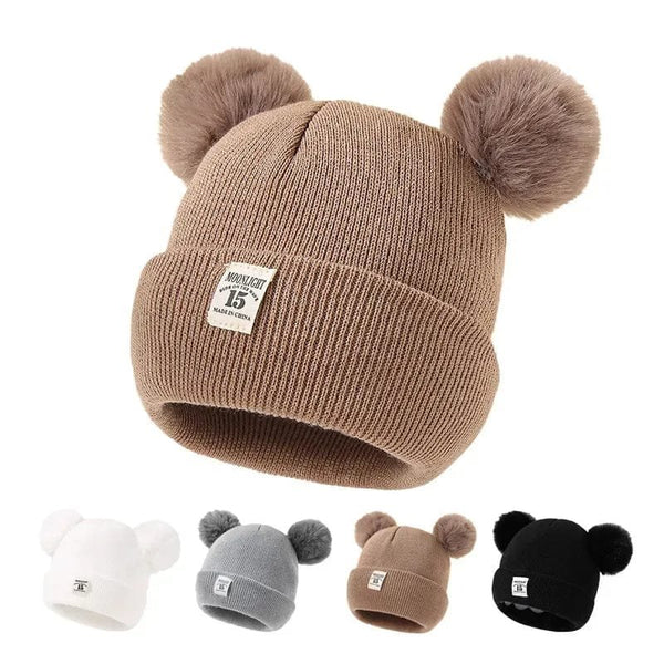 Warm Knitted Baby Beanie with pom poms in a range of colours for autumn and winter warmth on daily outings.