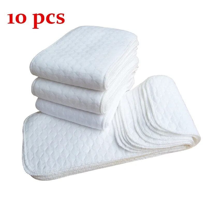 Washable microfiber diaper liner inserts folded and stacked for laundry-friendly diapering and repeat daily use.