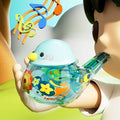 Child holding a blue water bird whistle with music notes above it