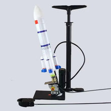 Water jet rocket launcher with stand and pump for backyard science play and outdoor summer fun.