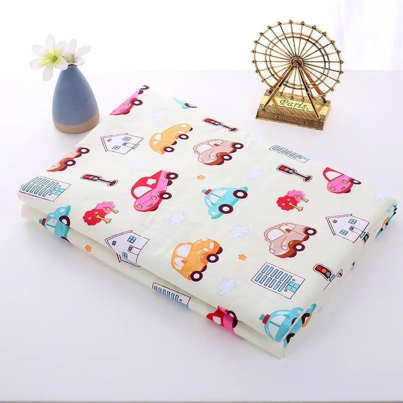 Roll of paper with colorful car pattern on a white surface