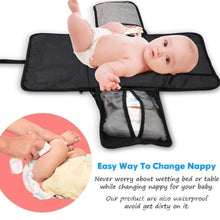 Waterproof baby changing pad feature guide with a baby lying on the mat for safe, padded nappy changes.