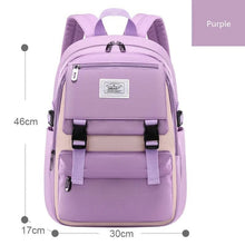 Purple waterproof girls campus backpack with size guide, offering large storage for school books, stationery, and sports kit.