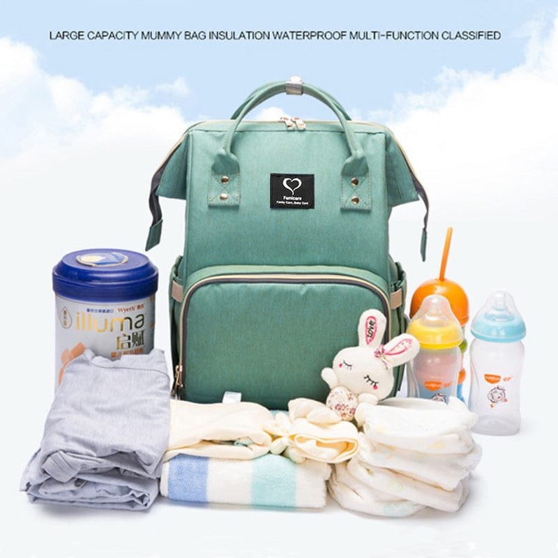 Green waterproof nursing backpack packed with baby care essentials such as bottles, wipes, and nappies for day trips with an infant.