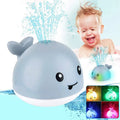 Gray whale-shaped bath toy with water sprays.