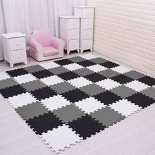 White, black, and gray EVA foam puzzle mat 18-piece set for a custom baby play floor.