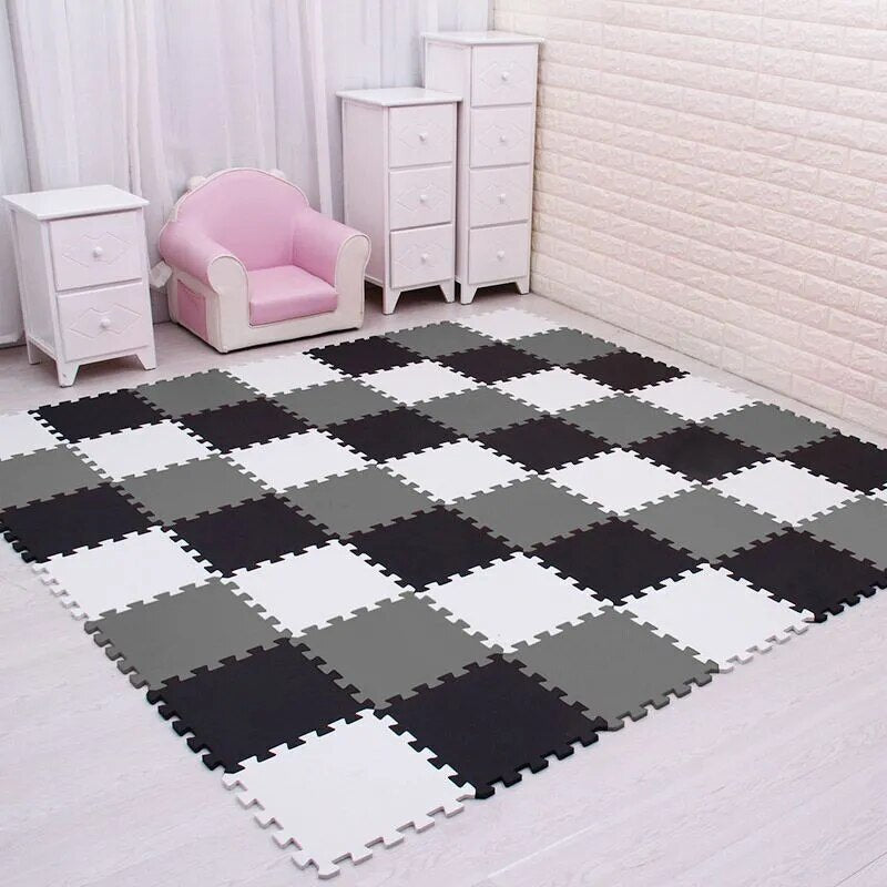 White, black, and gray EVA foam puzzle mat 36-piece set for covering a large play floor.