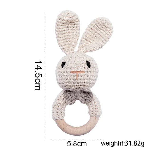 White bunny crochet rattle and teether wooden ring, a soft baby gift for showers, namings, and first birthdays.