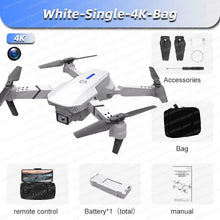 White E88 Pro foldable drone with remote and carry items for compact travel and weekend aerial filming.