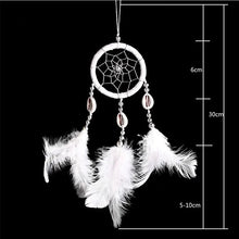 White feather and bead dream catcher styled for everyday Indian-inspired home decor.