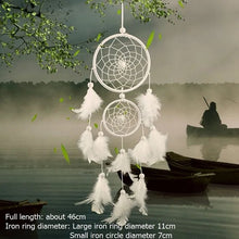 White feather rattan dream catcher handcrafted as artistic wall decor.