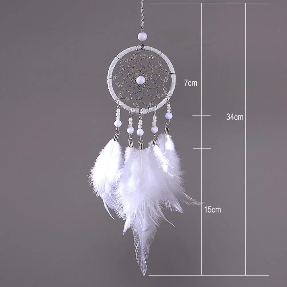 White feather rattan dream catcher photographed on gray with size guide for wall hanging.