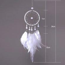 White feather rattan dream catcher photographed on gray with size guide for wall hanging.