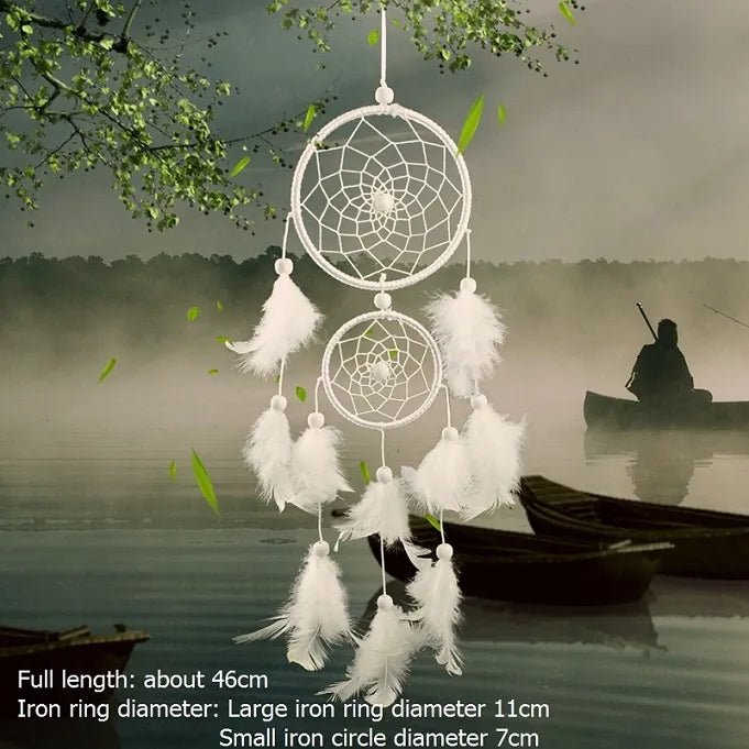 White feather rattan dream catcher styled against a misty lake scene for nature decor.