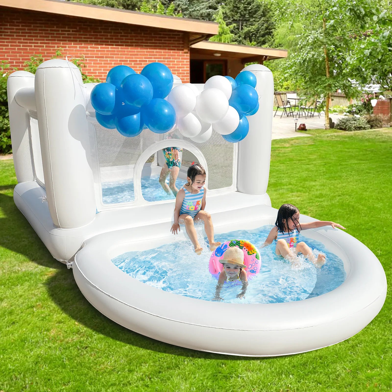 White Kids Bounce House with Pump inflatable castle and pool set up on a grassy lawn for outdoor summer play.