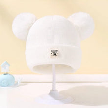 White Warm Knitted Baby Beanie with pom pom ears for cosy autumn and winter dressing on pram walks.