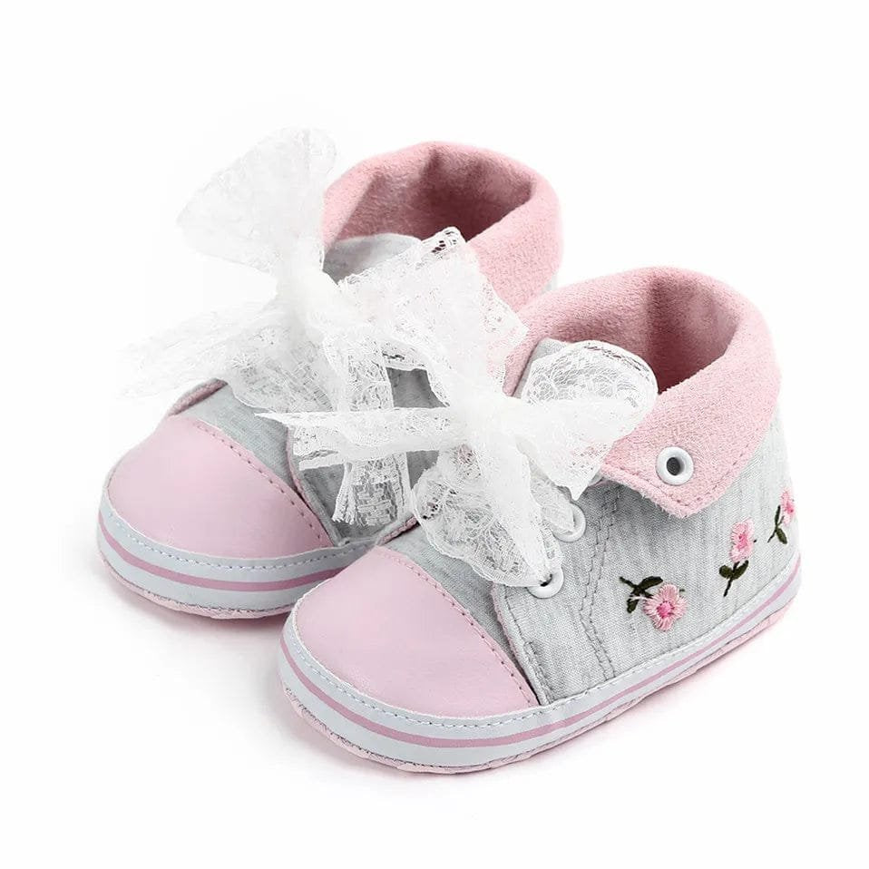 White lace floral baby girl shoes for first steps, soft walkers that support babies moving from crawling to standing.