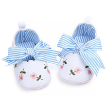 Front and side combination view of the white lace floral baby girl shoes, showing the full prewalker shape for daily wear.