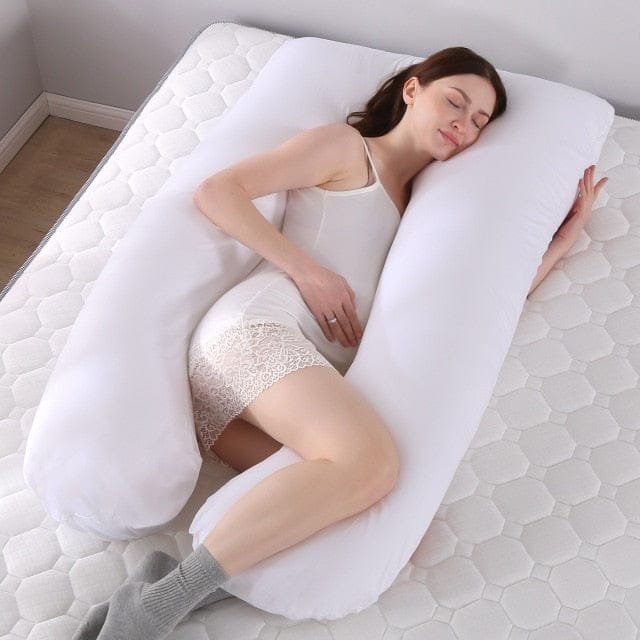 Sleeping Support Pillow in white for pregnant women, a U shaped maternity cushion for supported night sleep.