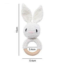 White rabbit cloud crochet wooden baby rattle and teether ring, a neutral colour option for newborn gifts.