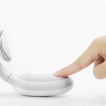 White smart neck massager device for targeted shoulder and neck relief during breaks, travel, and evenings.