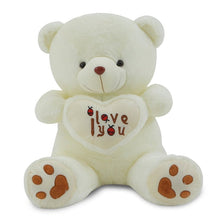 White teddy bear holding an I Love You heart cushion, a stuffed toy gift for Valentines Day and special occasions.