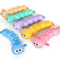 Six pastel wind-up caterpillar toys in orange, mint, purple, yellow, blue and pink on a white background