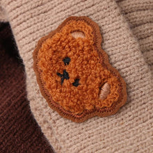 Close-up of the bear face patch and knit texture on the winter baby beanie, showing the soft yarn used for toddler comfort.