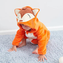 Orange fox winter flannel romper child on a gray carpet in a fifth photo highlighting the flannel texture.