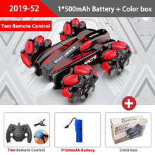 Red WLtoys stunt RC car with remote, battery, and packaging, a drift toy car for kids racing at home or in the park.