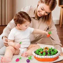 Woman and child playing with the Montessori Colorful Shape Carrot toy garden set on the floor.