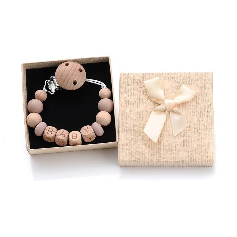 Wood pattern silicone beaded pacifier clip personalized with baby name for gender-neutral nursery gifting.