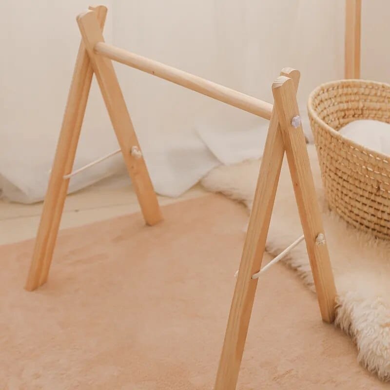 CE certified wooden baby activity gym for 0 to 12 month olds, supporting reaching, kicking, and visual tracking.