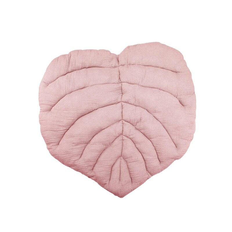 Heart-shaped pink cushion.