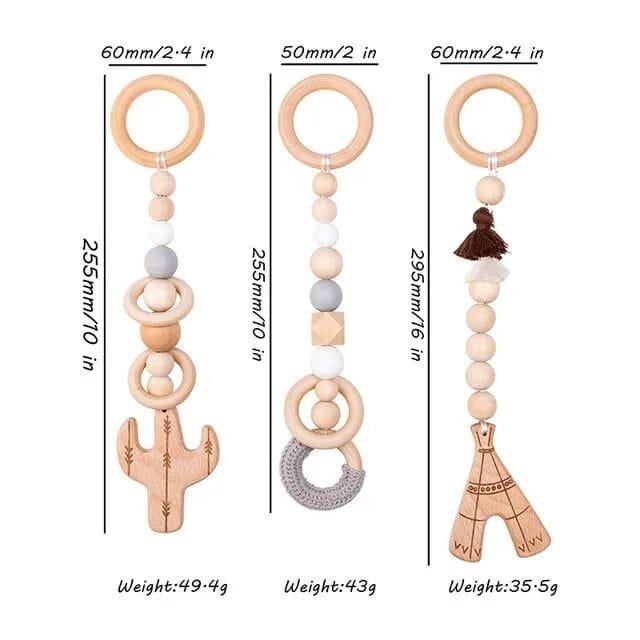 Three wooden baby teething toys with measurements and weights on a white background