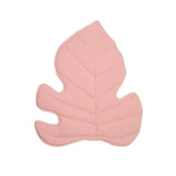 Pink leaf-shaped cushion on a white background
