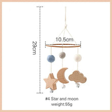 Wooden baby mobile with stars, moon, and wood balls shown with sizes, a calming hanging toy for nursery cots.