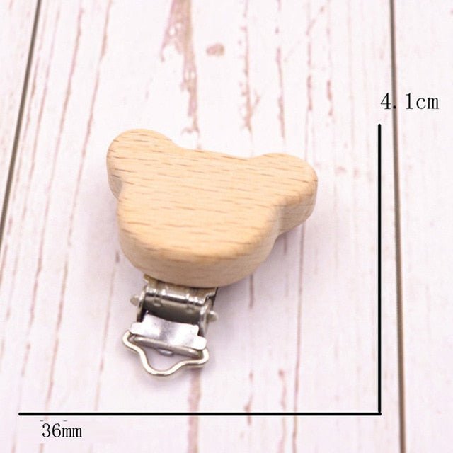 Wooden bear pacifier clip shown with measurements, a smooth teether holder for safe dummy attachment during daily care.