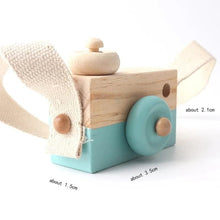 Wooden camera pendant with turquoise base and beige accents, a DIY Montessori toy for creative kids play.
