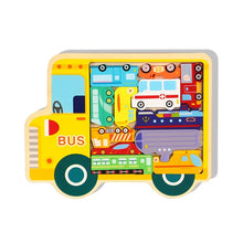 Yellow bus-shaped wooden jigsaw puzzle with colorful vehicle pieces including an ambulance