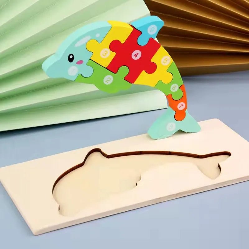 Wooden dolphin puzzle for toddlers fitting ocean shapes together and building spatial skills.