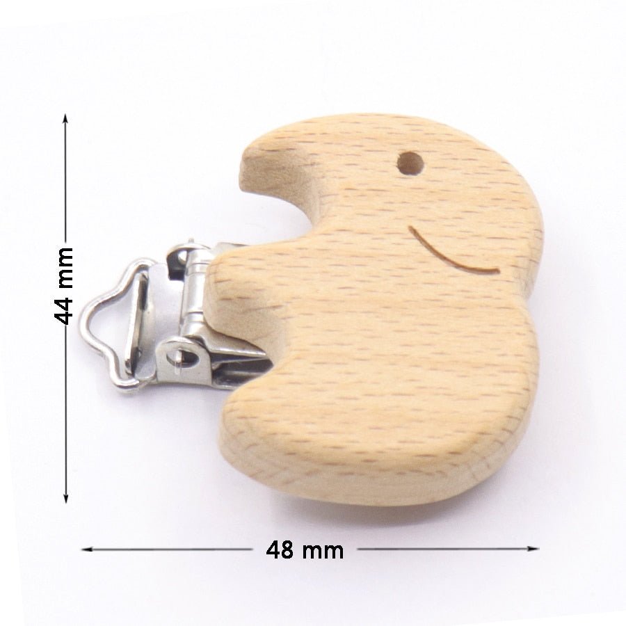 Wooden elephant teether with metal pacifier clip and sizing, a chewable holder for teething relief and dummy storage.