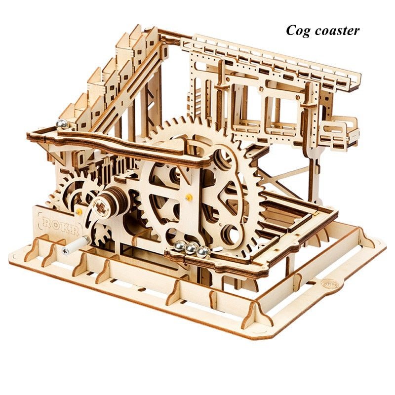 Wooden gear drive marble run cog coaster model for children practising mechanical assembly and imaginative play.