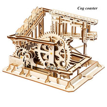Wooden gear drive marble run cog coaster model for children practising mechanical assembly and imaginative play.