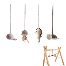 Crochet sea creature pendants for the wooden baby play gym, hanging toys that build focus and hand-eye coordination.