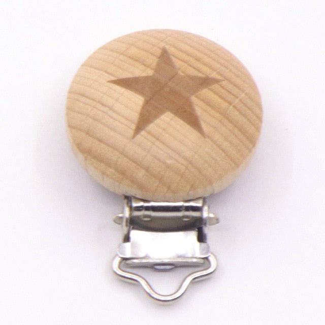 Wooden pacifier clip with star engraving, a teether dummy holder for nursery routines and travel with newborns.