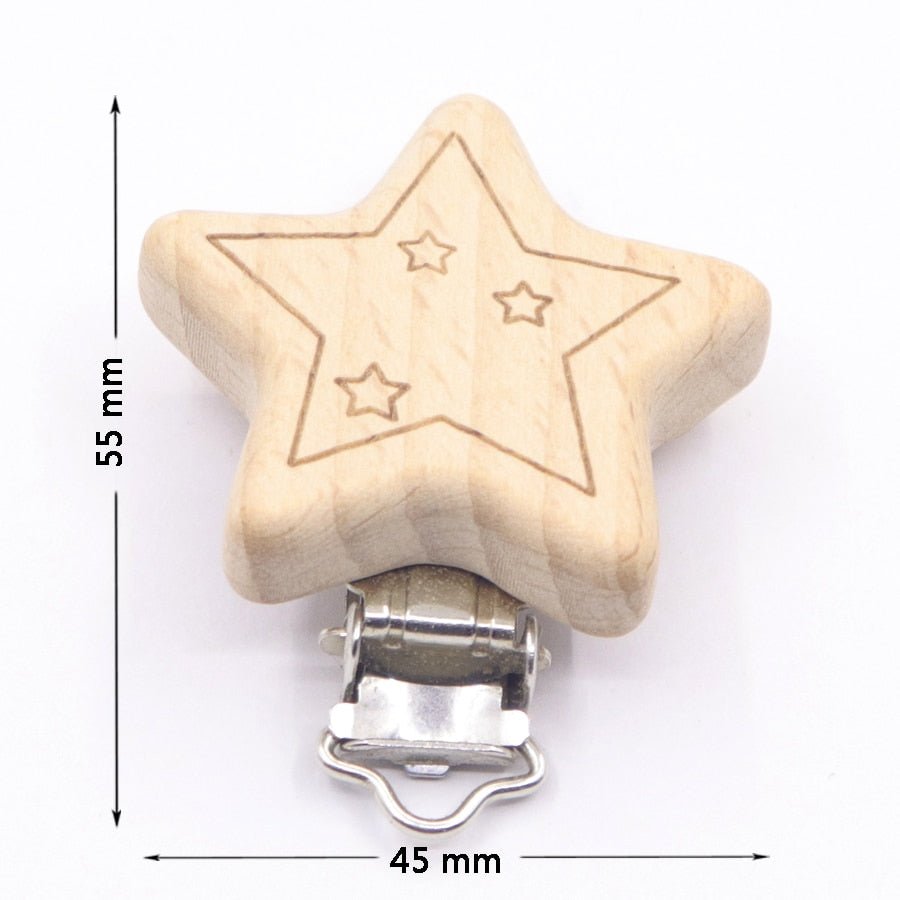 Star shaped wooden pacifier clip with engraved stars, a beech teether holder for soothing babies at bedtime.