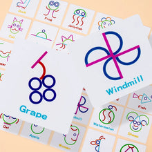 Close-up of picture cards including Grape and Windmill among cards for a cat, owl, apple, fish and sheep