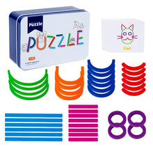 Iron puzzle box and cat card above stacks of colored arcs, sticks and purple rings